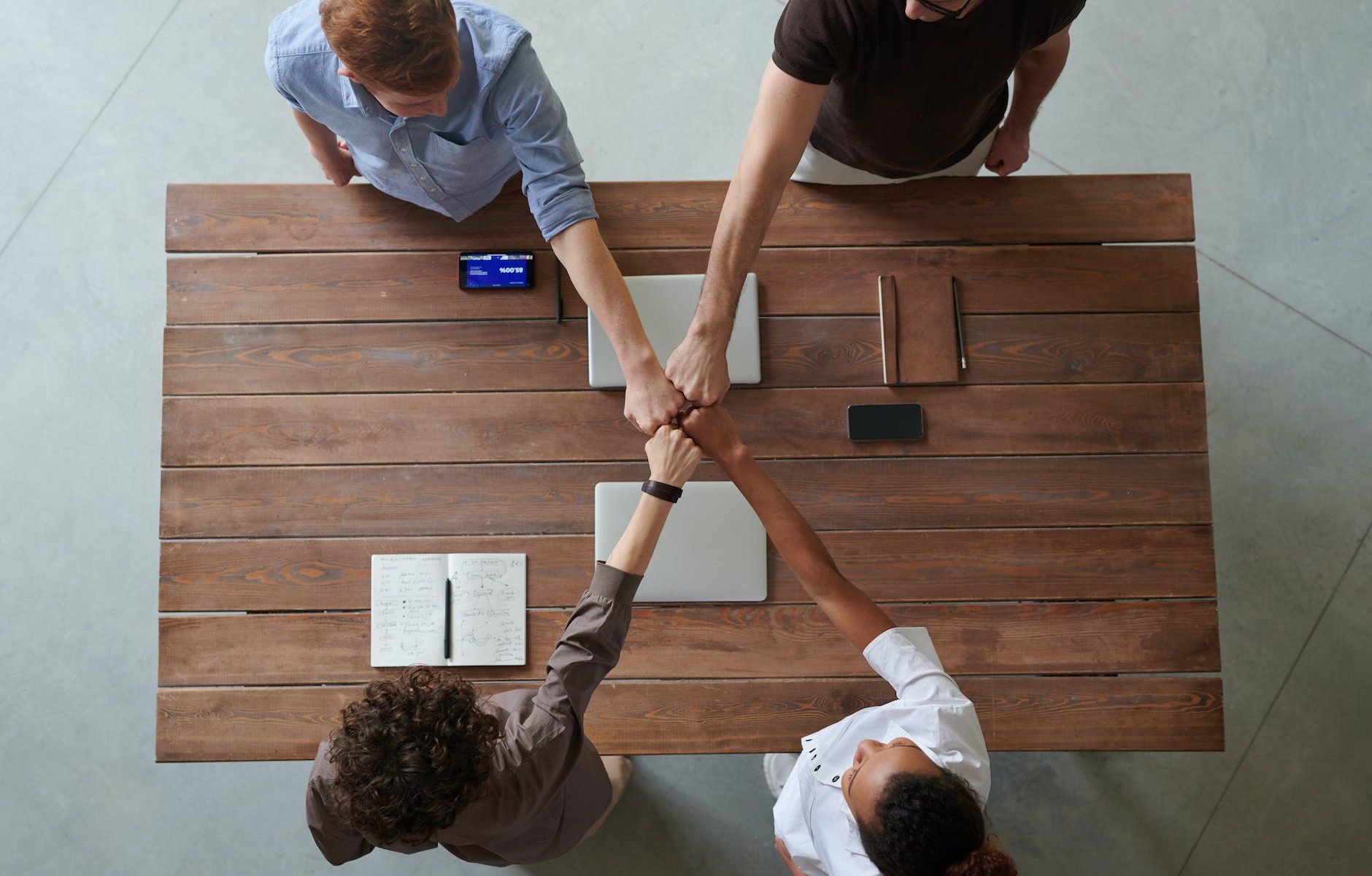 photo of people doing fist bump